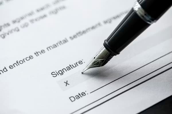 Legal documents and contract signing on a professional desk