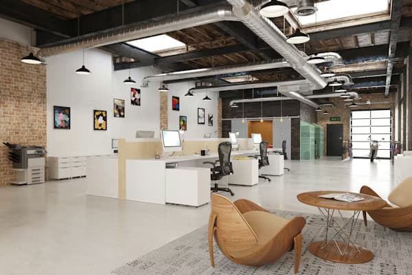 Modern coworking space with natural light and professionals working remotely
