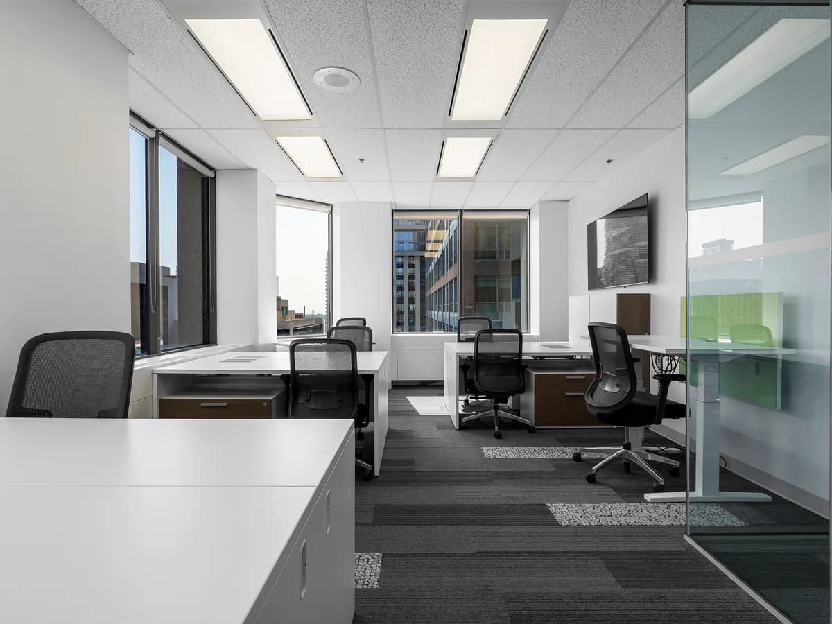 Private office interior with desks and glass partition, Silicon Valley
