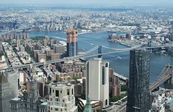 Aerial view of a city skyline representing multi-city business expansion