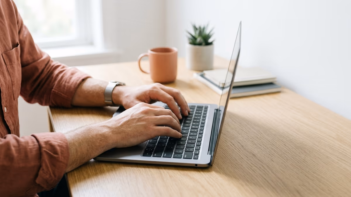 Hands typing on a laptop while setting up a virtual business address step by step