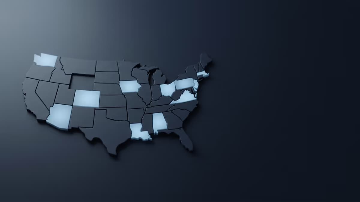 An abstract relief map of the United States with several states highlighted, representing state-by-state money transmitter licensing.