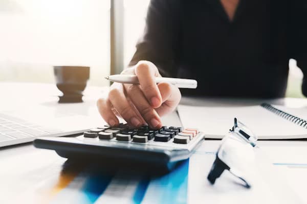 Business finance calculator and budget planning workspace